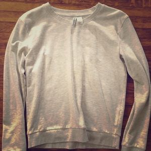 Light grey long sleeve sweater.